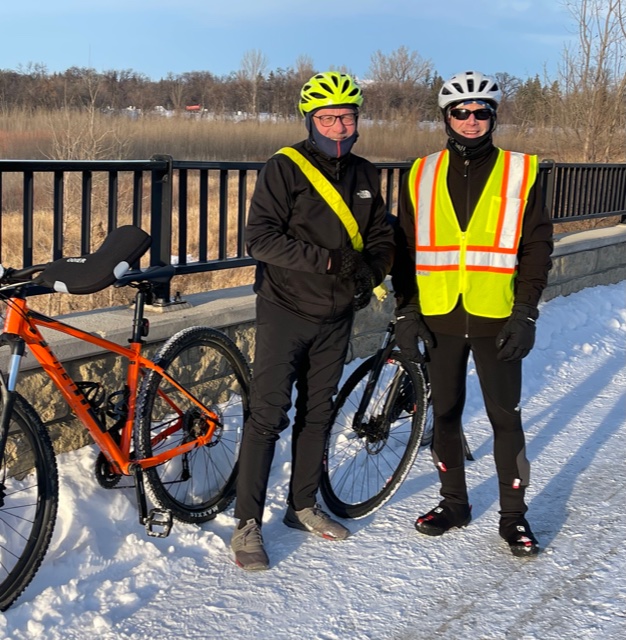Dr. Dequet and Dr. Allen in bike gear