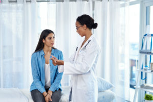 Doctor checking a woman's condition