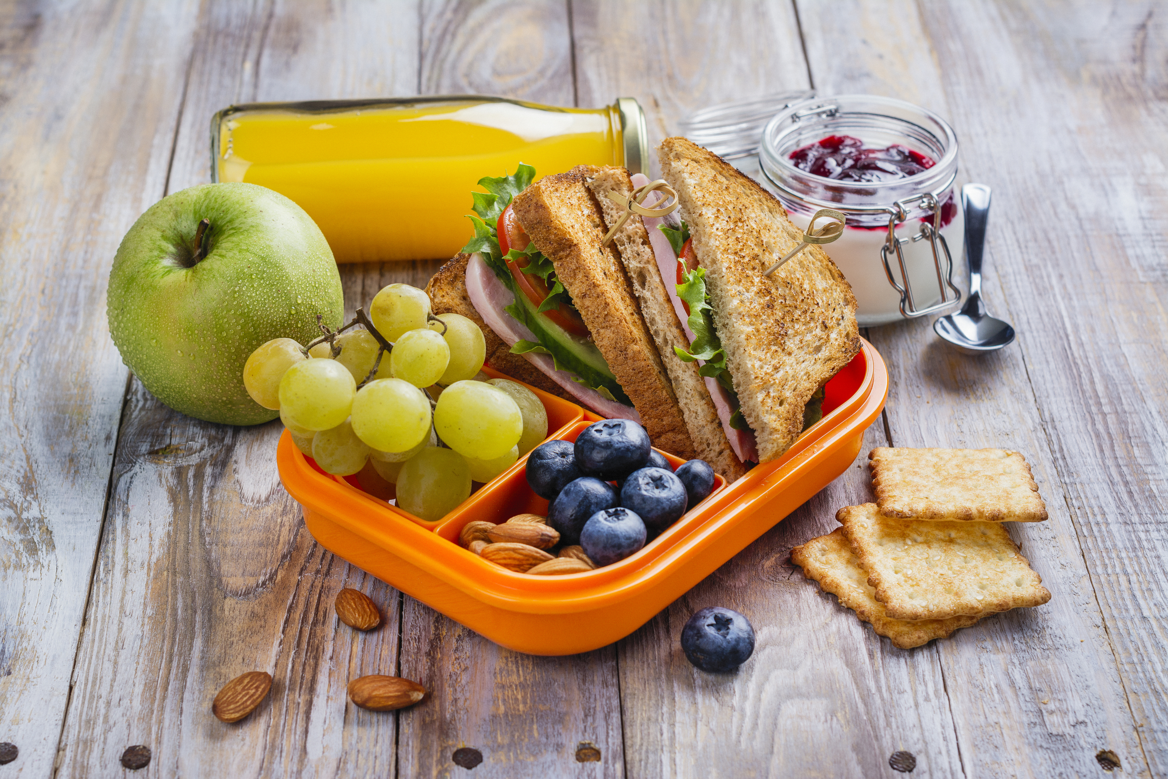 Healthy Sack Lunch with sandwich, fruit and juice