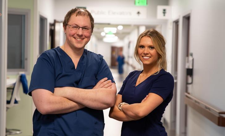 two nurses in hospital hallway