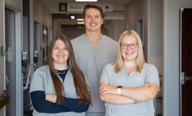 Three Altru therapists in scrubs.