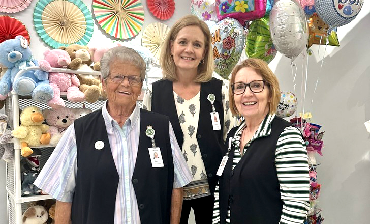 Three Altru volunteers in the gift shop.
