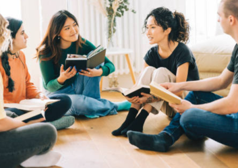 Adults sitting in a circle at book club.