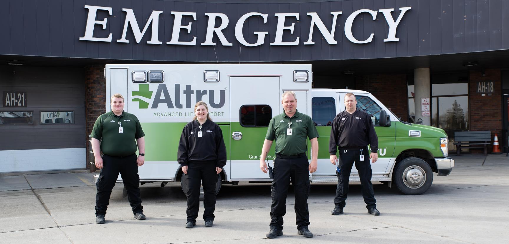 Emergency services staff in front of ER