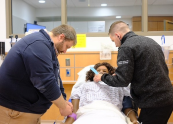 Resident providers working on a SIM.