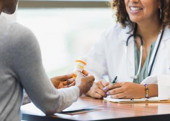 A patient consulting with their doctor about medication.