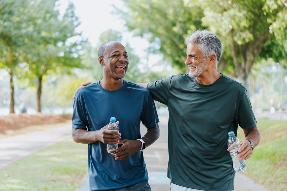 Two men walking on path
