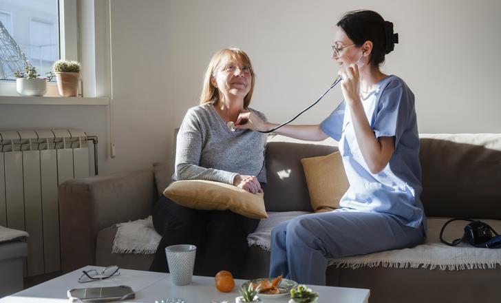 Provider at home sitting with patient
