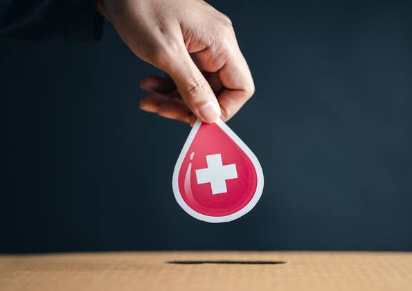 Hand-Donating-Drop-of-Blood