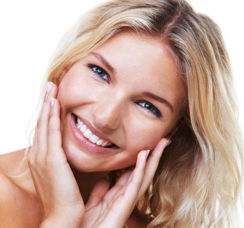 Woman smiling with a healthy skin 