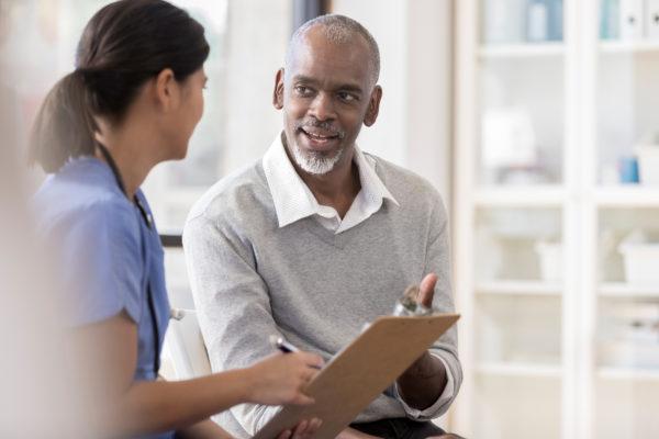 nurse talking to patient