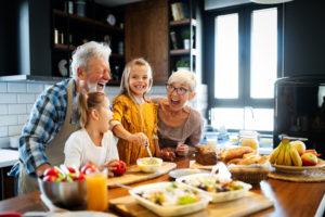 Grandparents with their grand children in the kitchen